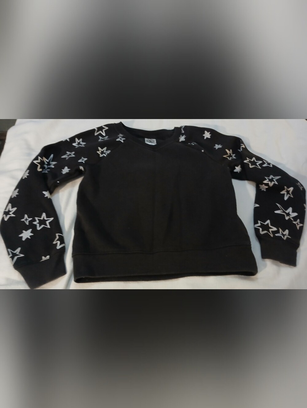 Pre-loved Girl's Athletic Works Black Crewneck Sweatshirt w/White Star Sleeves.